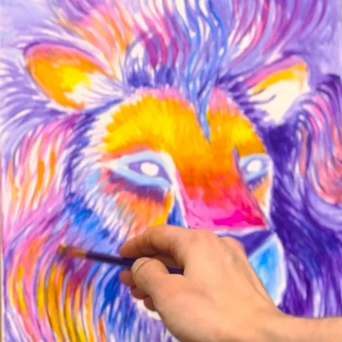 Module 4: Dan's hand and brush working magenta, orange and yellow into the lion's face as the glow starts to build