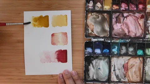 Demonstrating water control with a loaded watercolor brush