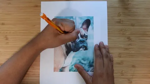 Transferring a dog's likeness from a printed photo onto watercolor paper