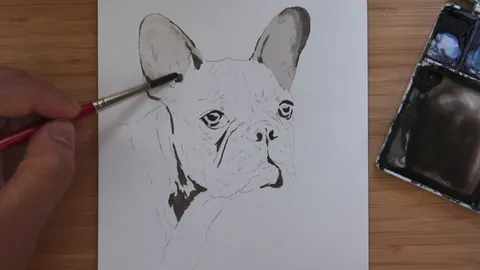 Laying the first wash of colour onto a dog portrait